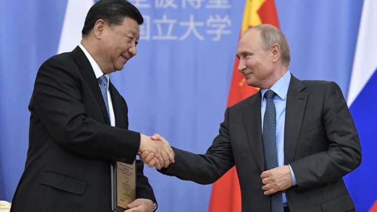 Giua lan song tay chay, ong Putin tuyen bo se du Olympic Bac Kinh 2022 hinh anh