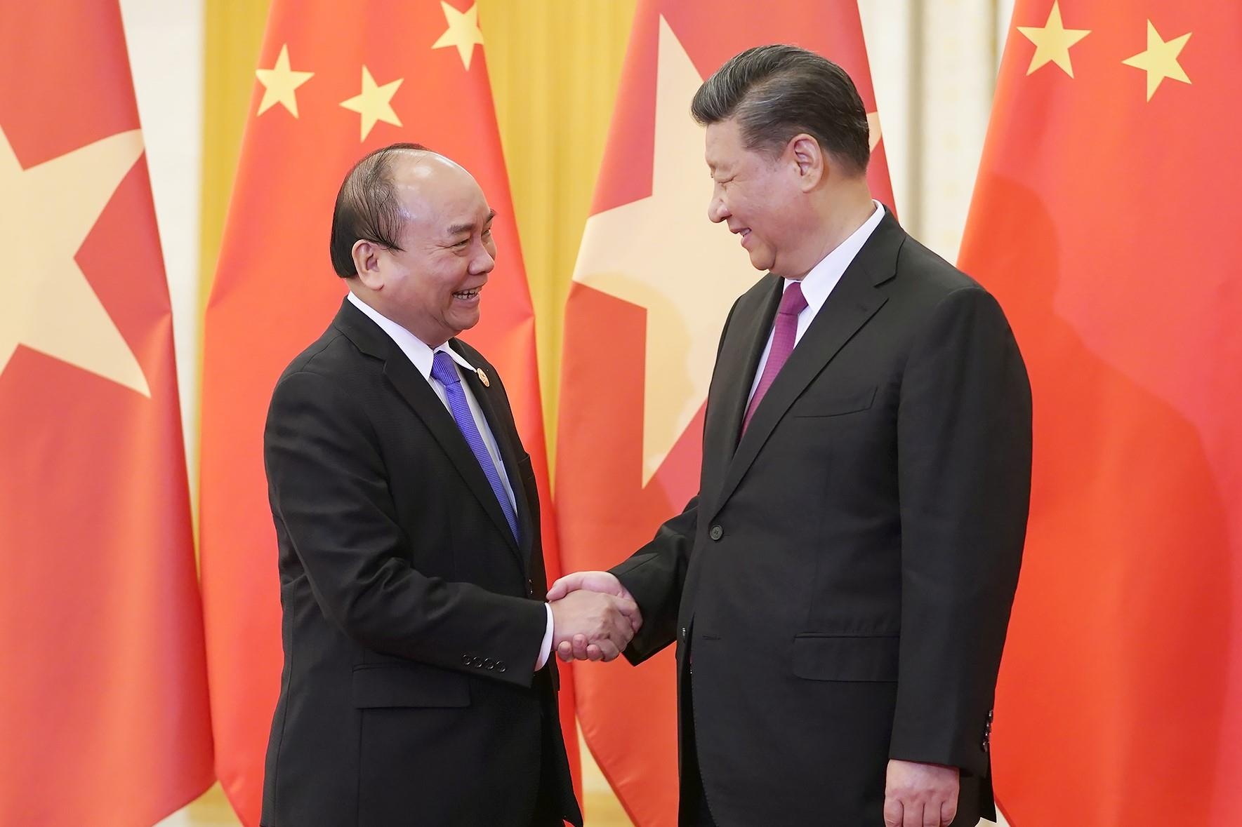 Thu tuong Nguyen Xuan Phuc hoi kien chu tich Trung Quoc hinh anh