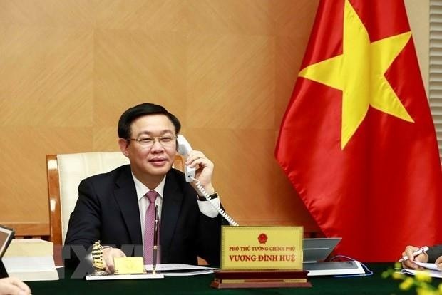 Pho thu tuong Vuong Dinh Hue dien dam Bo truong Tai chinh My hinh anh