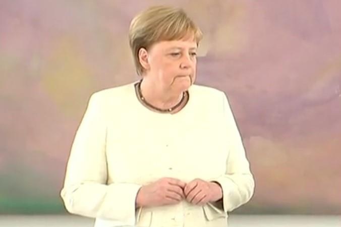 Thu tuong Merkel run lay bay trong su kien cung tong thong Duc hinh anh