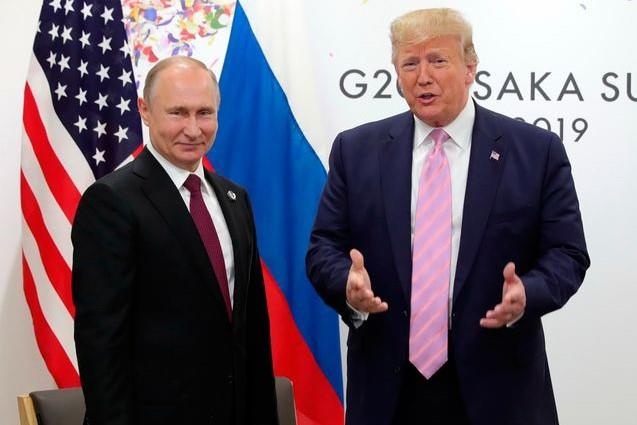 TT Trump bao 'dung can thiep bau cu nhe', ong Putin chi cuoi khay hinh anh