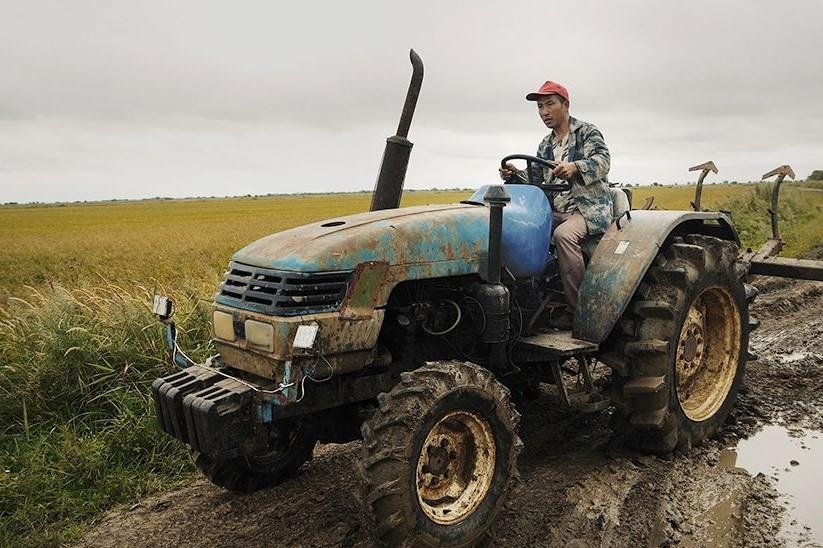 Lan song nong dan Trung Quoc do ve vung Vien Dong nuoc Nga hinh anh
