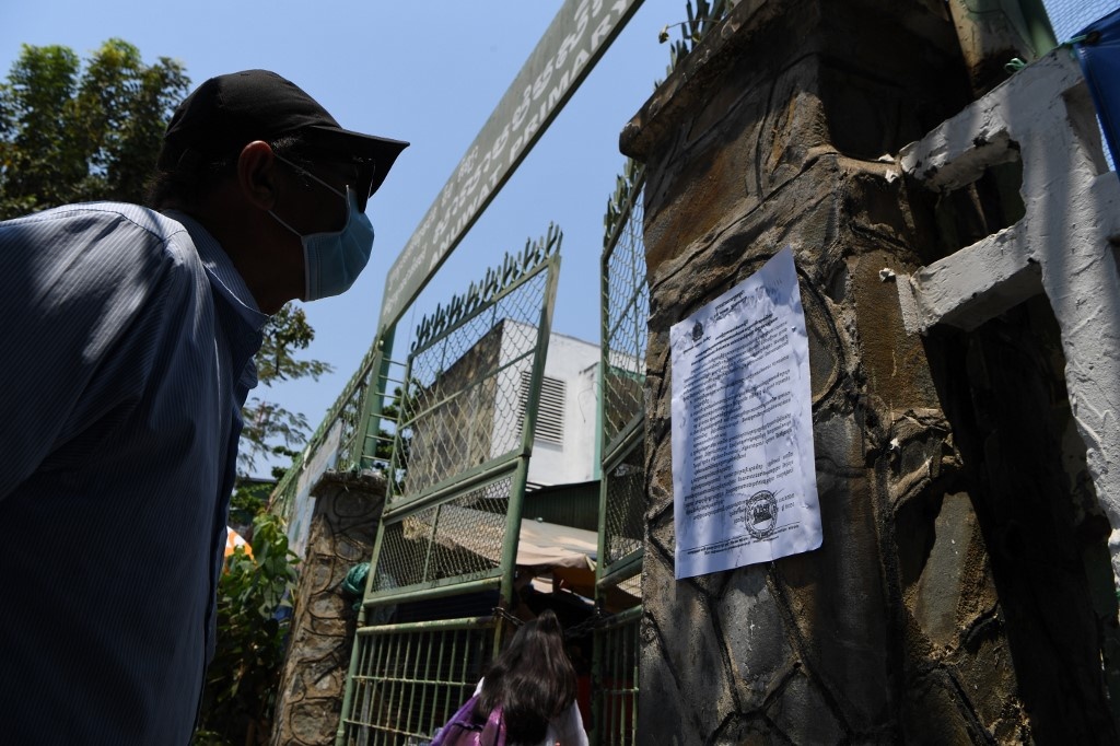 Ca benh Covid-19 o Campuchia tang gap doi, nhieu nguoi ve tu Malaysia hinh anh