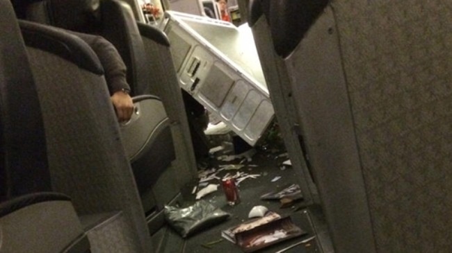 May bay Boeing 777-200 ha canh khan cap tai Nhat Ban hinh anh