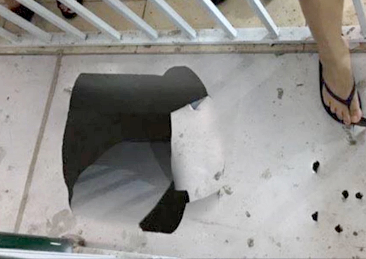 Be trai lot qua san roi xuong ham anh 1