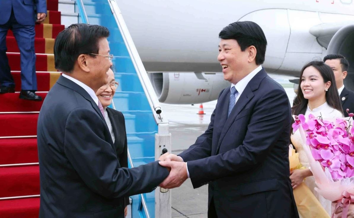 Tong Bi thu, Chu tich nuoc Lao bat dau tham cap Nha nuoc toi Viet Nam hinh anh