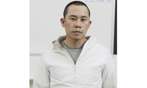 Đàm Quốc Thành tại cơ quan công an.