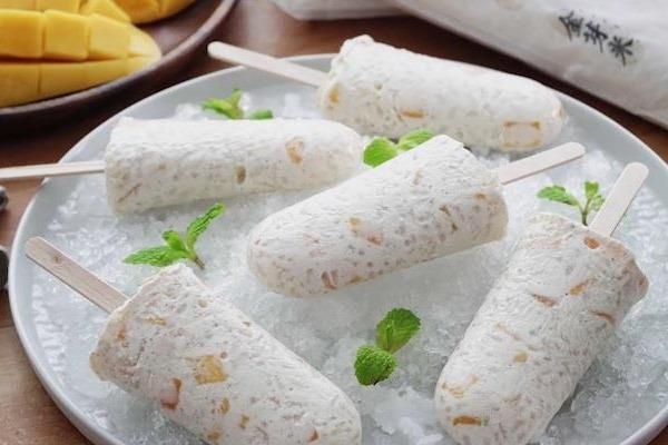 Bien tau mon kem xoai sua dua nhan gao Kinmemai doc la hinh anh