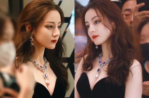 Dich Le Nhiet Ba dien vay cup nguc goi cam hinh anh