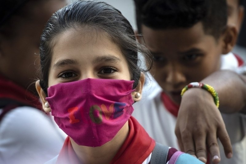 WHO va Singapore thay doi lap truong, khuyen khich deo khau trang hinh anh