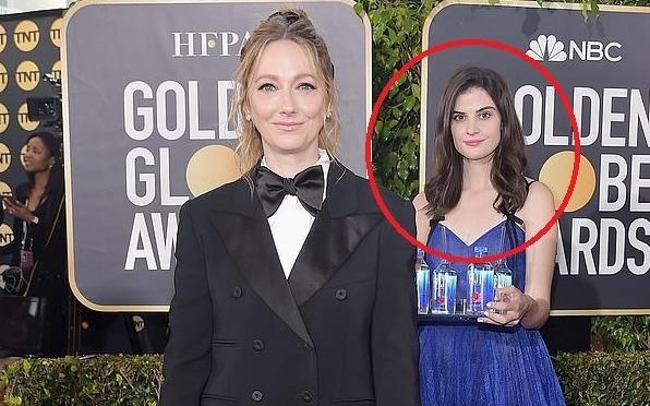 Co gai be nuoc noi bat giua dan sao Hollywood tai Qua cau vang la ai? hinh anh