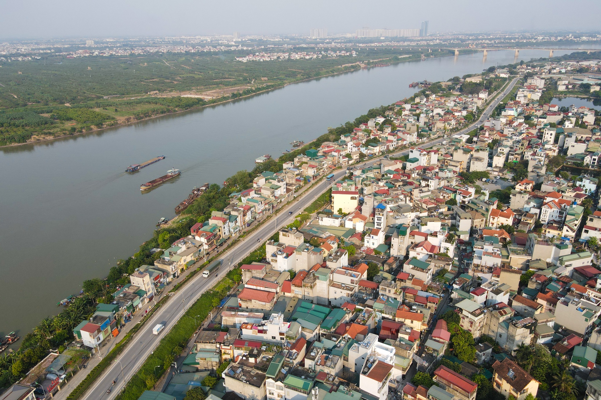 Nguoi dan duoc loi, chiu thiet gi boi quy hoach phan khu song Hong? hinh anh