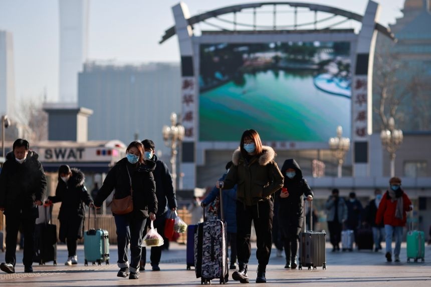 Nguoi Trung Quoc duoc van dong khong ve que an Tet hinh anh