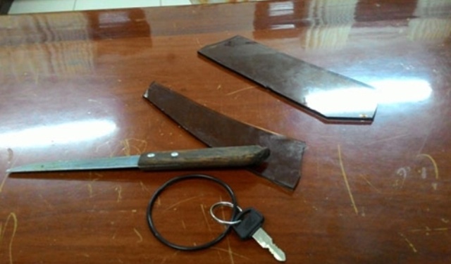 Hung khí nghi phạm sử dụng khống chế con tin. Ảnh CAND