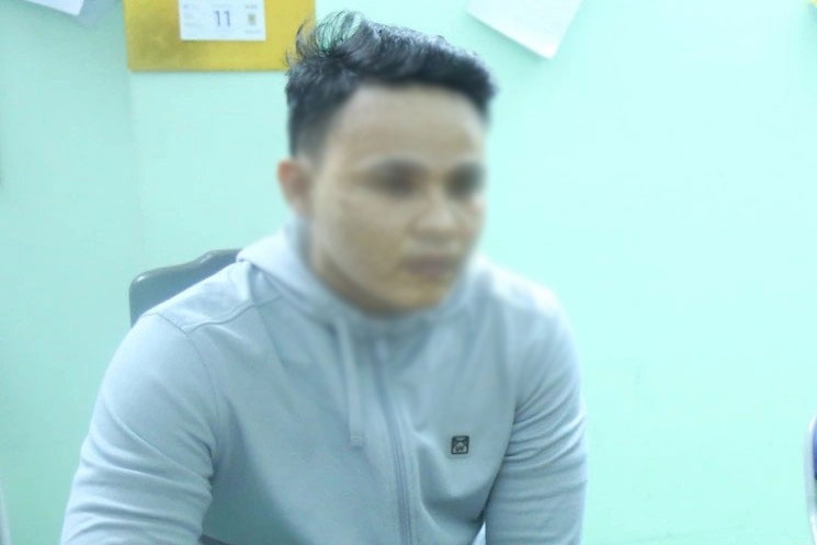 Cong an Binh Duong lam viec voi nguoi dua tin sai su that hinh anh