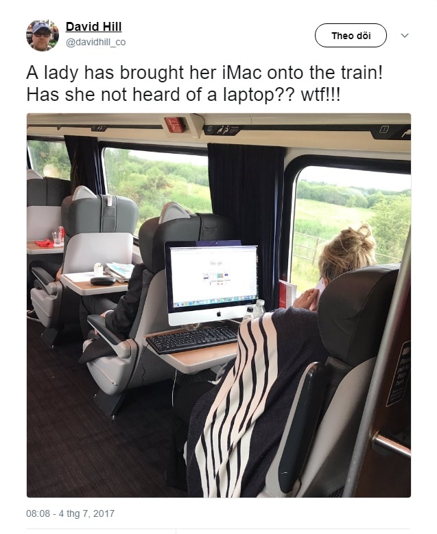 nguoi phu nu dem iMac len tau hoa anh 2