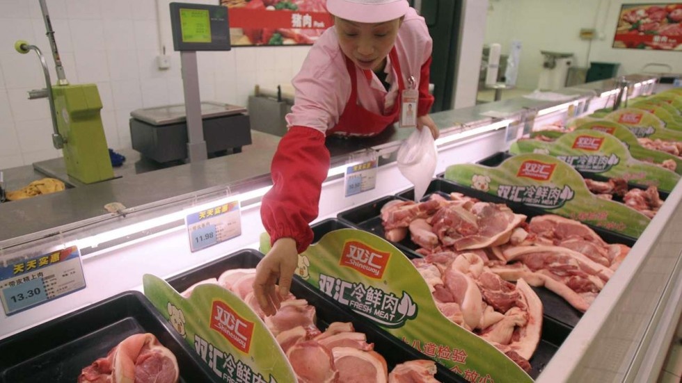 Doanh nghiep Trung Quoc tra no bang thit lon thay cho tien mat hinh anh