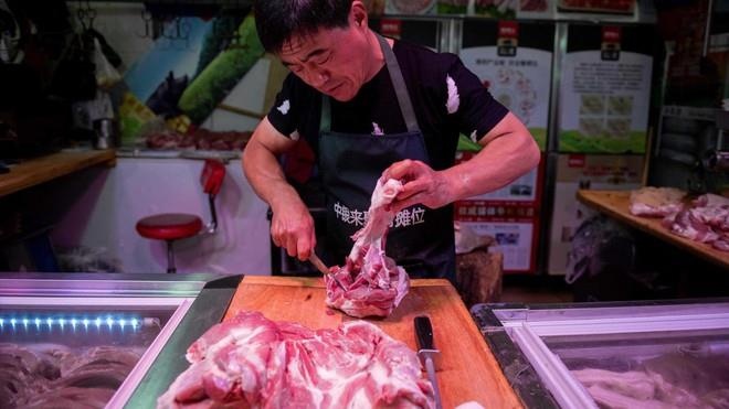 Dich ta chau Phi giet 40% so lon Trung Quoc, gia thit se tiep tuc tang hinh anh