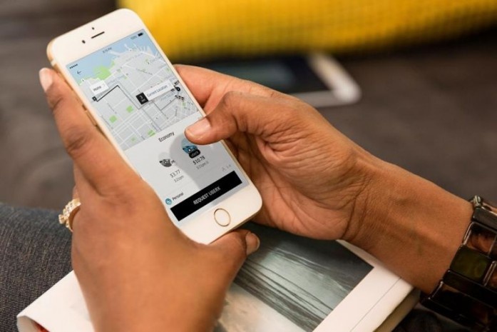 Singapore tri hoan ung dung Uber Grab sap nhap 15/4 anh 1