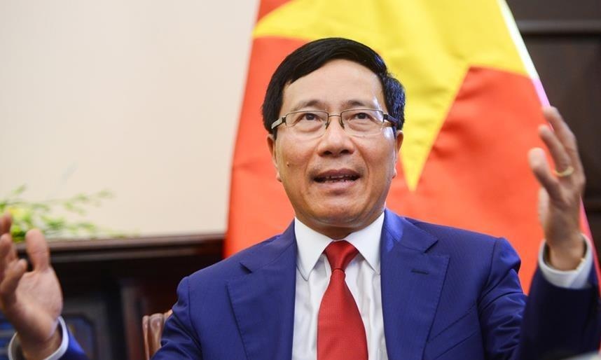 Pho thu tuong Pham Binh Minh tra loi chat van Quoc hoi hinh anh