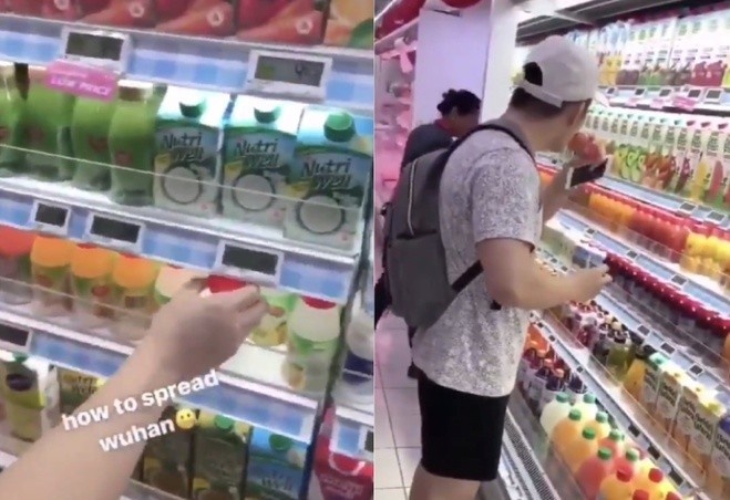 2 thanh nien Singapore bi bat vi uong thu nuoc trai cay trong sieu thi hinh anh