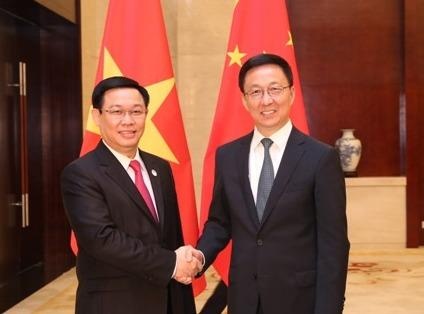 Pho thu tuong Vuong Dinh Hue tiep pho thu tuong Trung Quoc hinh anh