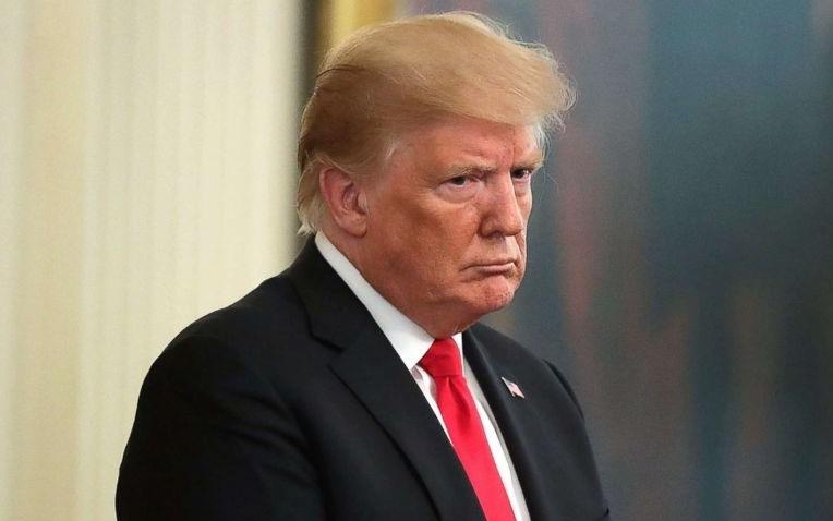 Tong thong Trump: Neu toi bi luan toi, nguoi dan se rat ngheo hinh anh