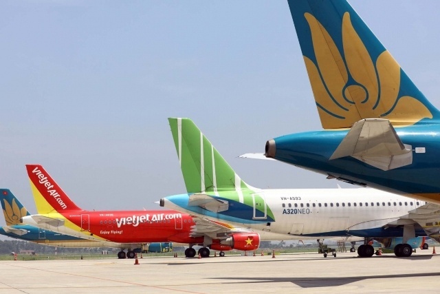 Gia ve may bay Vietjet va Vietnam Airlines khong con chenh nhieu hinh anh