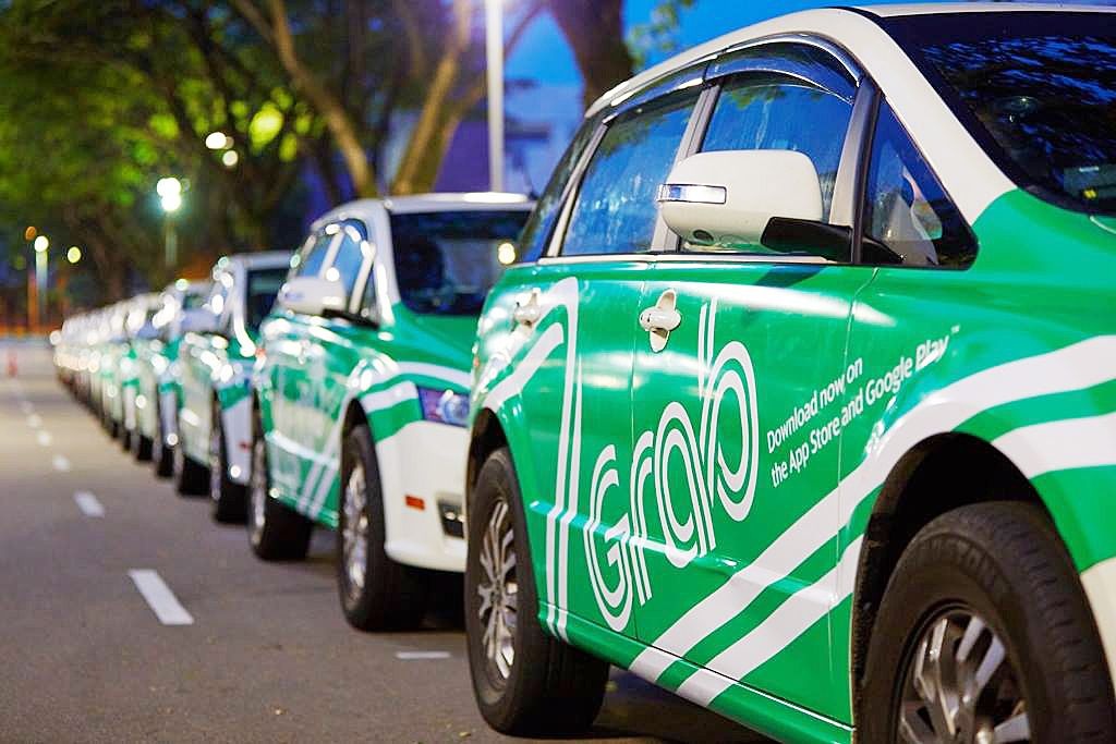 Bloomberg: Grab sap chot thuong vu thau tom Uber Dong Nam A hinh anh