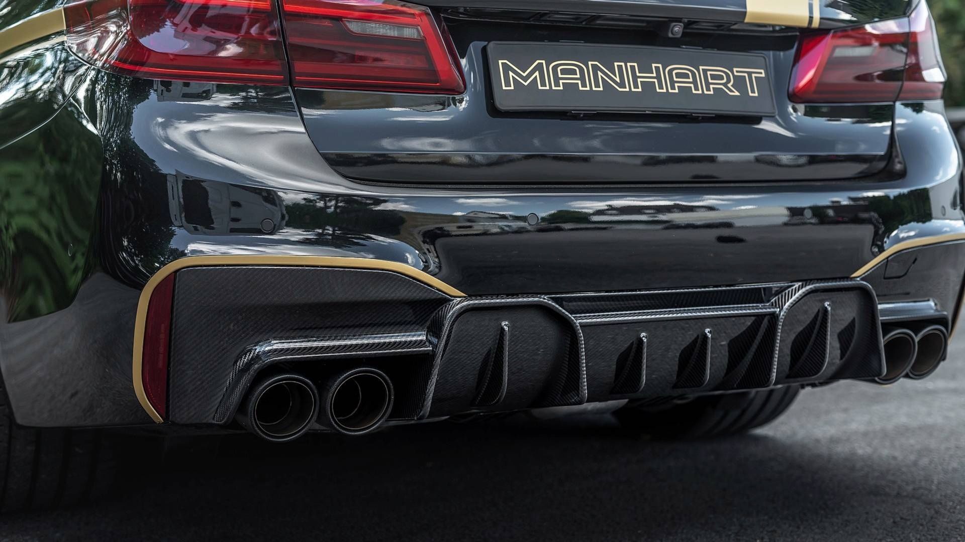 BMW M5 dữ dằn hơn với bản độ của Manhart ảnh 3 BMW M5 du dan hon voi ban do cua Manhart anh 3