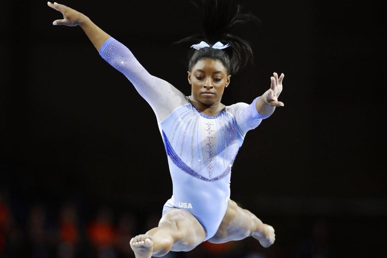 Nu hoang TDDC Biles thuc hien dong tac chua tung co o giai the gioi hinh anh