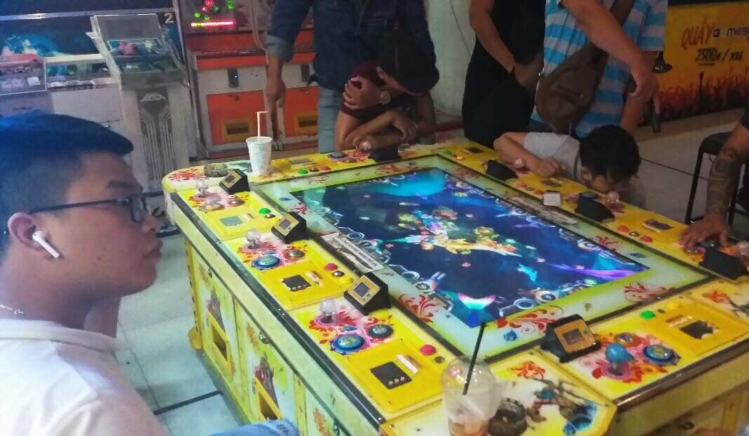 Bắt nhóm người tổ chức chơi game bắn cá ảnh 2 Bat nhom nguoi to chuc choi game ban ca anh 2