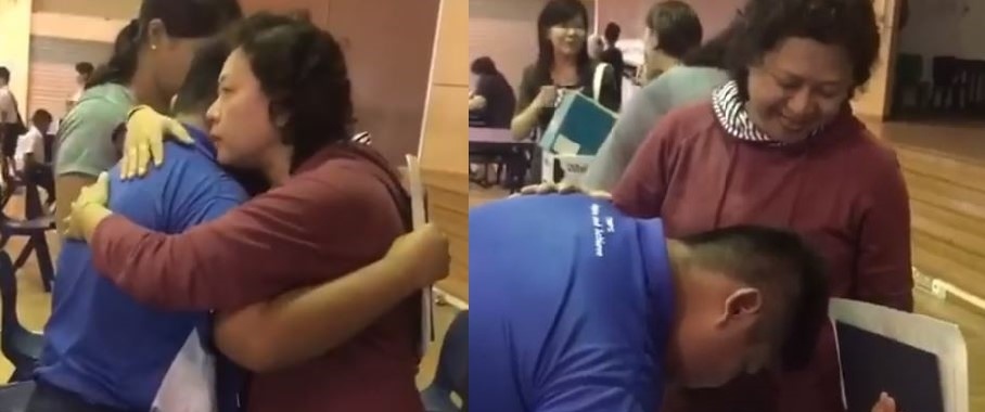 giao vien om hoc sinh anh 1