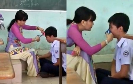 Nam hoc sinh duoc co giao cat toc ngay tai lop hinh anh