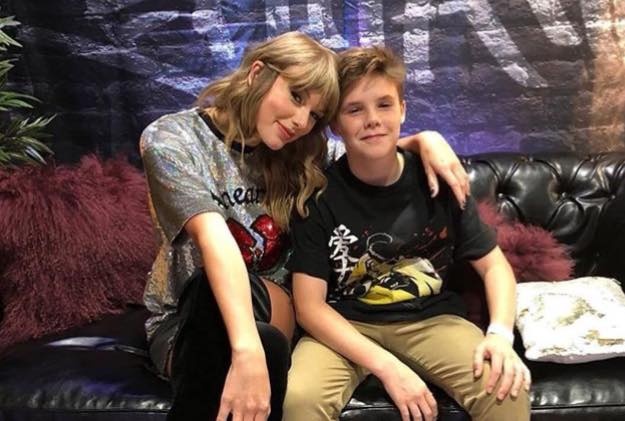 David Beckham dua cac con den xem show Taylor Swift hinh anh