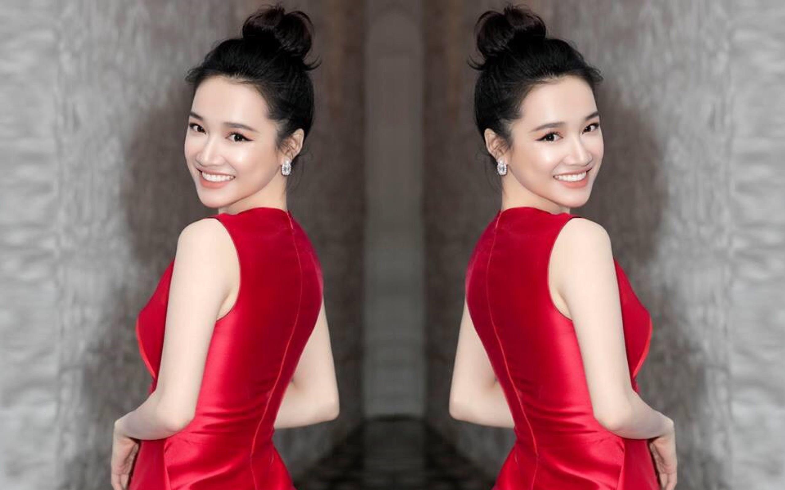 Nha Phuong ton da trang voi dam peplum do ruc ro hinh anh