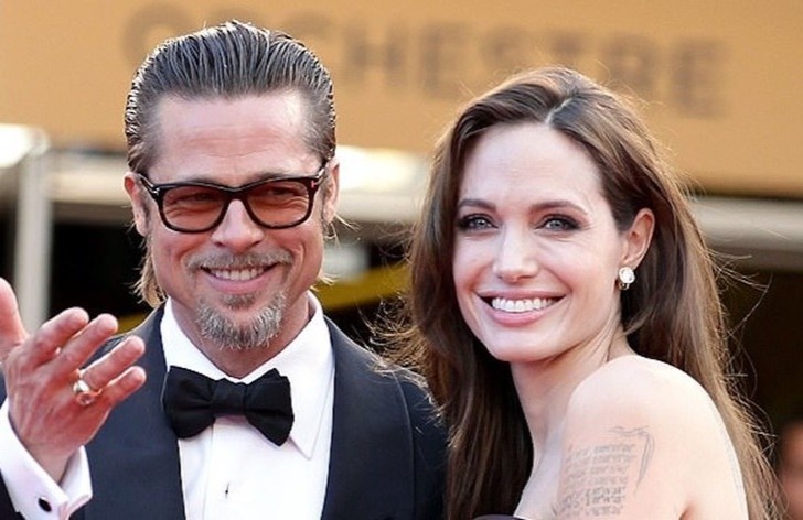 Angelina Jolie va Brad Pitt cung cham con sau phau thuat hinh anh