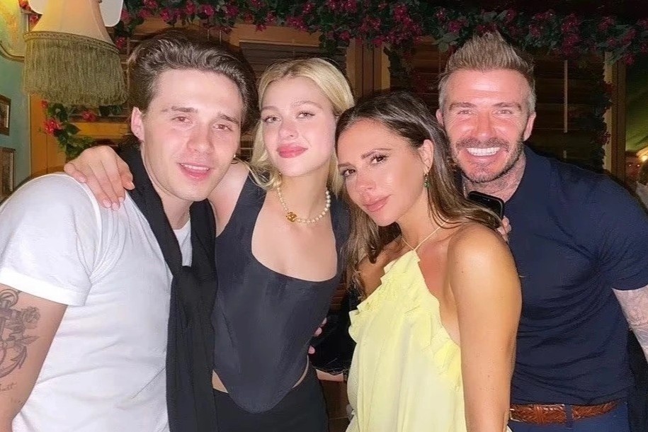 Victoria Beckham dau long vi ran nut voi con dau hinh anh