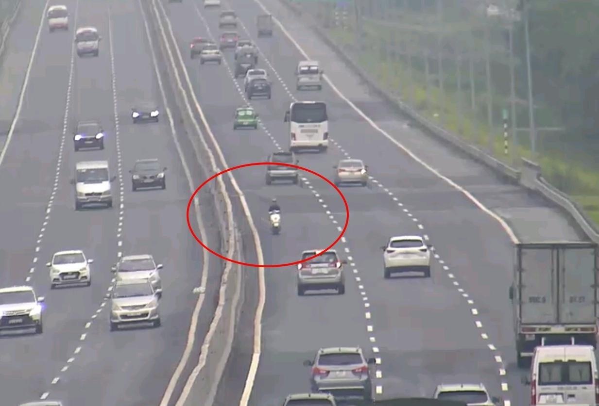 Nguoi di xe may nguoc chieu tren cao toc bi phat 750.000 dong hinh anh