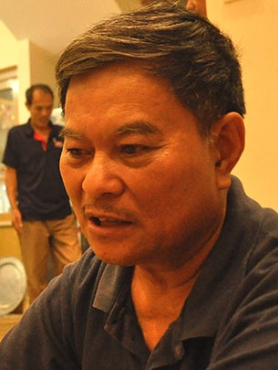 Gương mặt đau đớn của ông Nguyễn Ngọc Khanh - bố chị Minh - Ảnh: Quang Thế