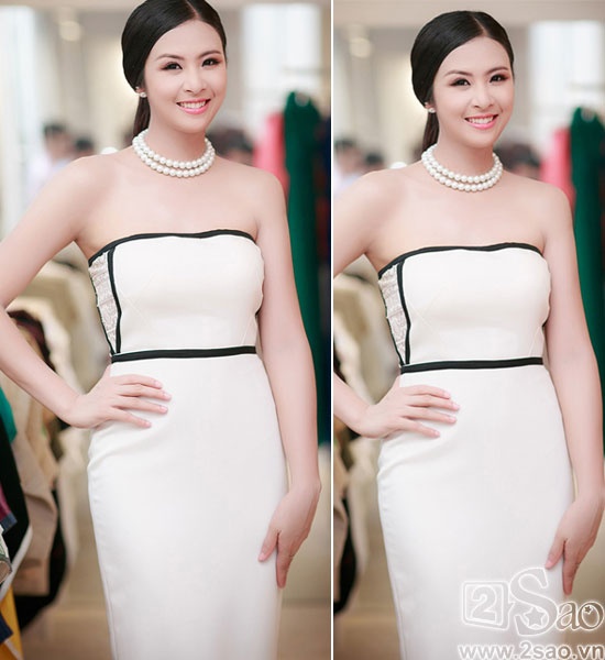 Hoa hậu Ngọc Hân mỗi lần xuất hiện đều mới lạ, đặc biệt với chiếc váy quây màu trắng được cách điệu đường viền đen giúp cô khoe tối đa đường cong hình chữ S.