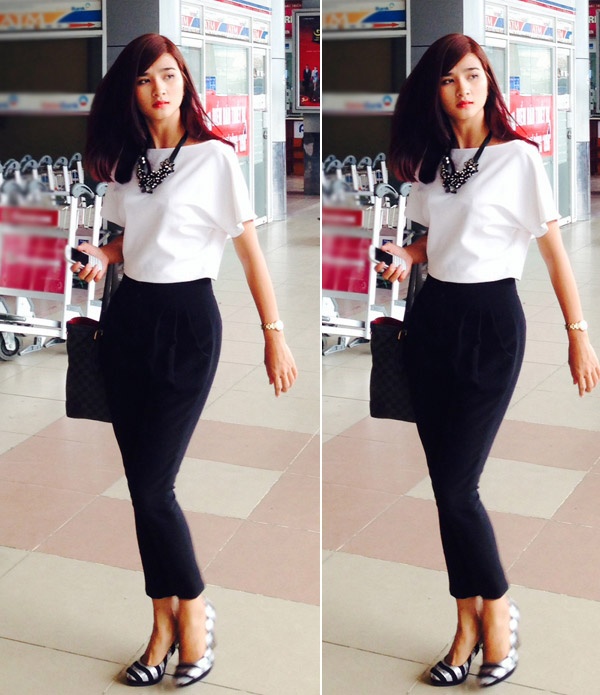 Những bạn gái muốn khoe eo thon, thân hình đường cong chữ S, hãy chọn dáng quần tây như của Kim Tuyến. Đôi giày kẻ sọc cũng giúp chủ nhân thêm bắt mắt giữa đám đông.