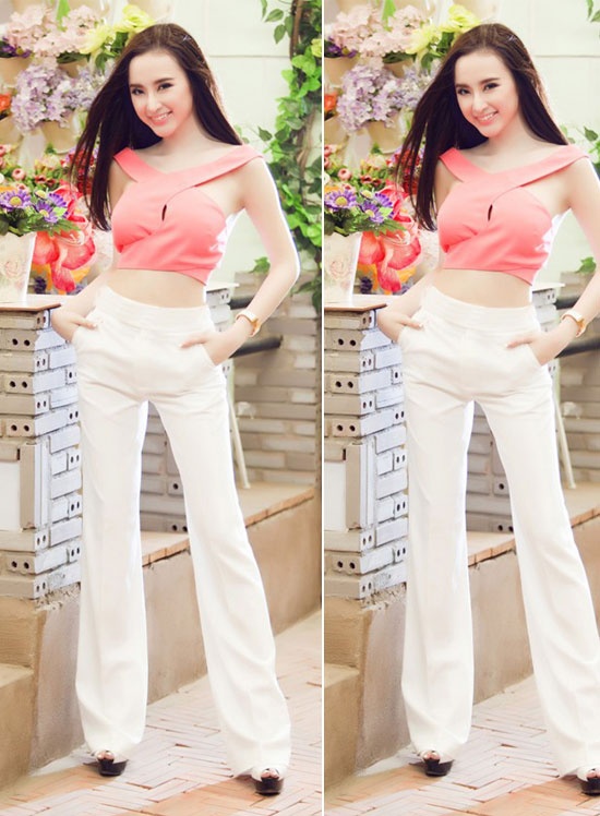 Angela Phương Trinh cuốn hút với quần ống loe trắng và áo crop top hồng khoe vòng eo