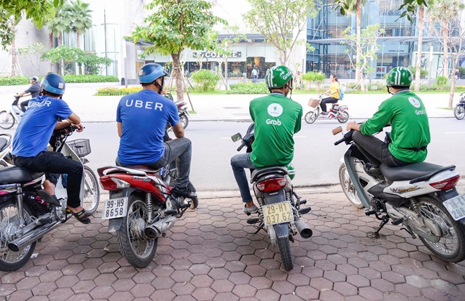 Thuong vu Grab mua Uber co dau hieu vi pham phap luat hinh anh