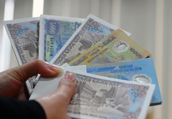 Ngan hang than kho doi tien moi li xi Tet, cho den bao nhieu cung co hinh anh