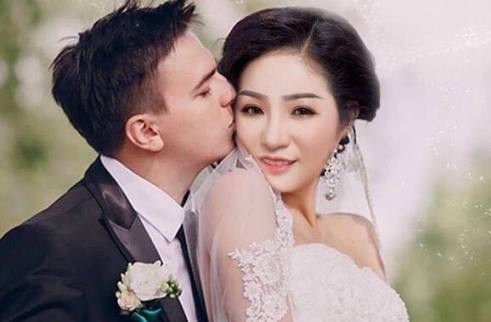 Thuy Nga khoe anh mac ao co dau ben nguoi dan ong tre hinh anh