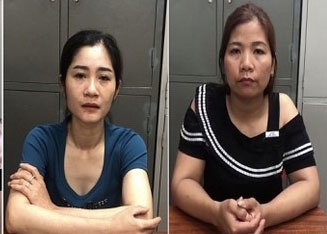 Hai nguoi phu nu lam dieu phi phap trong vu truong hinh anh