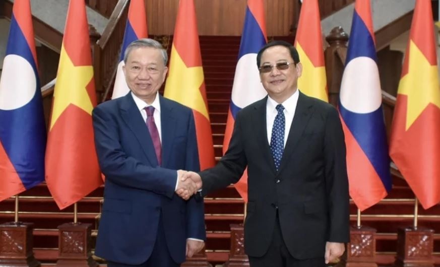 Chu tich nuoc To Lam hoi kien Thu tuong Lao Sonexay Siphandone hinh anh