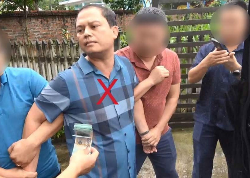 Chan tuong ke mao danh can bo cuc canh sat kinh te lua 'chay an' hinh anh