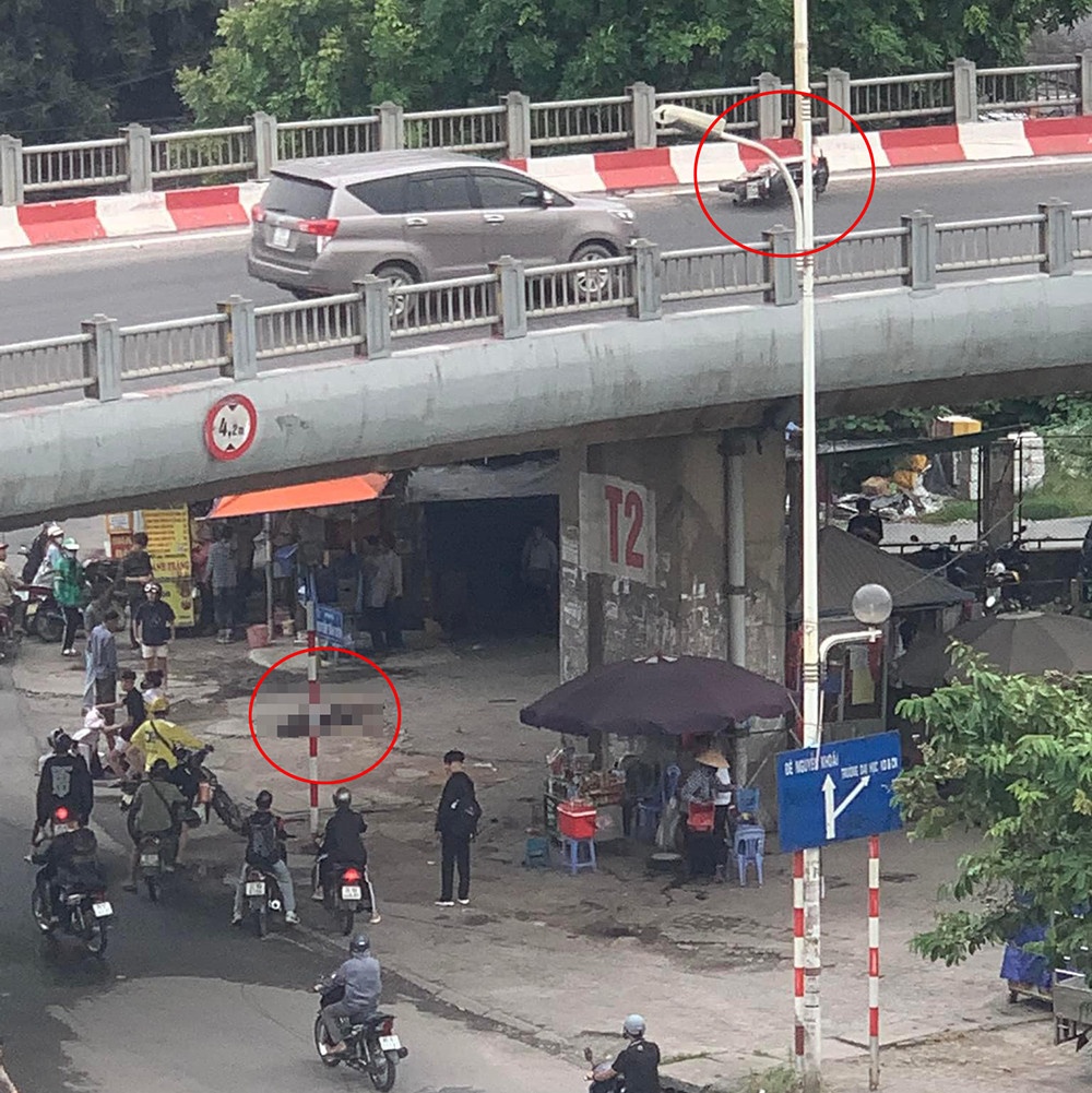 Nguoi di xe may dam phai lan can duong dan cau Vinh Tuy hinh anh